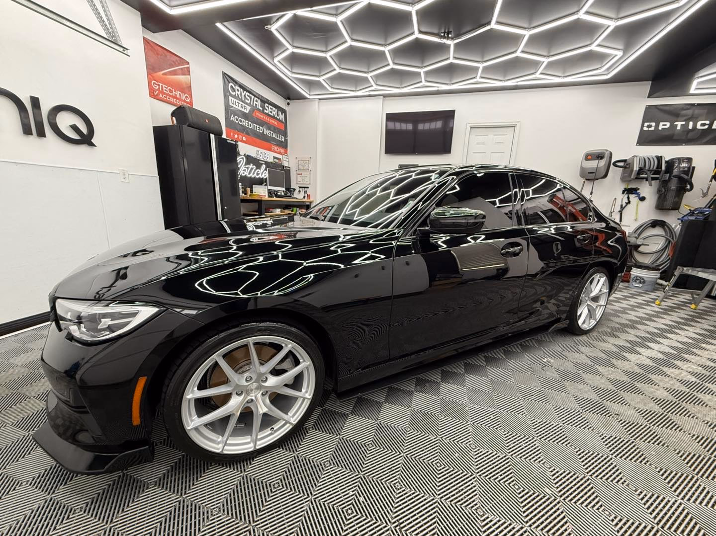 BMW 3 Series — fresh Gtechniq Crystal Serum Ultra under hex lighting.
