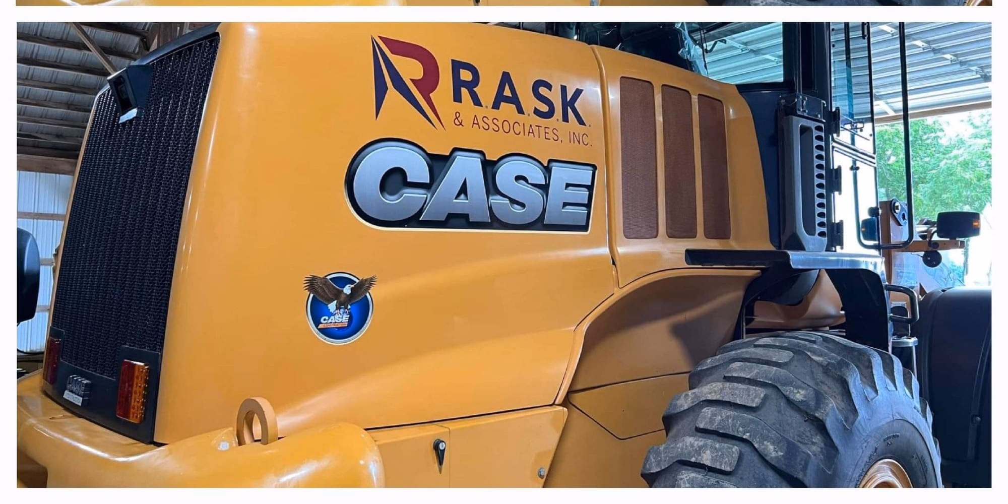 Post-correction: Case wheel loader hood, before and after multi-stage paint correction by Cecil