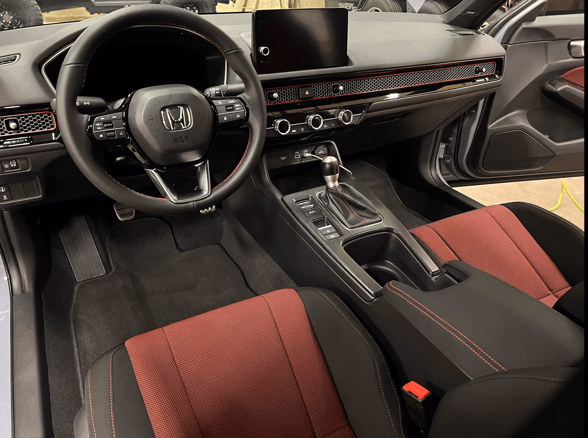 Steam-cleaned vents, console, and floor under controlled lighting.