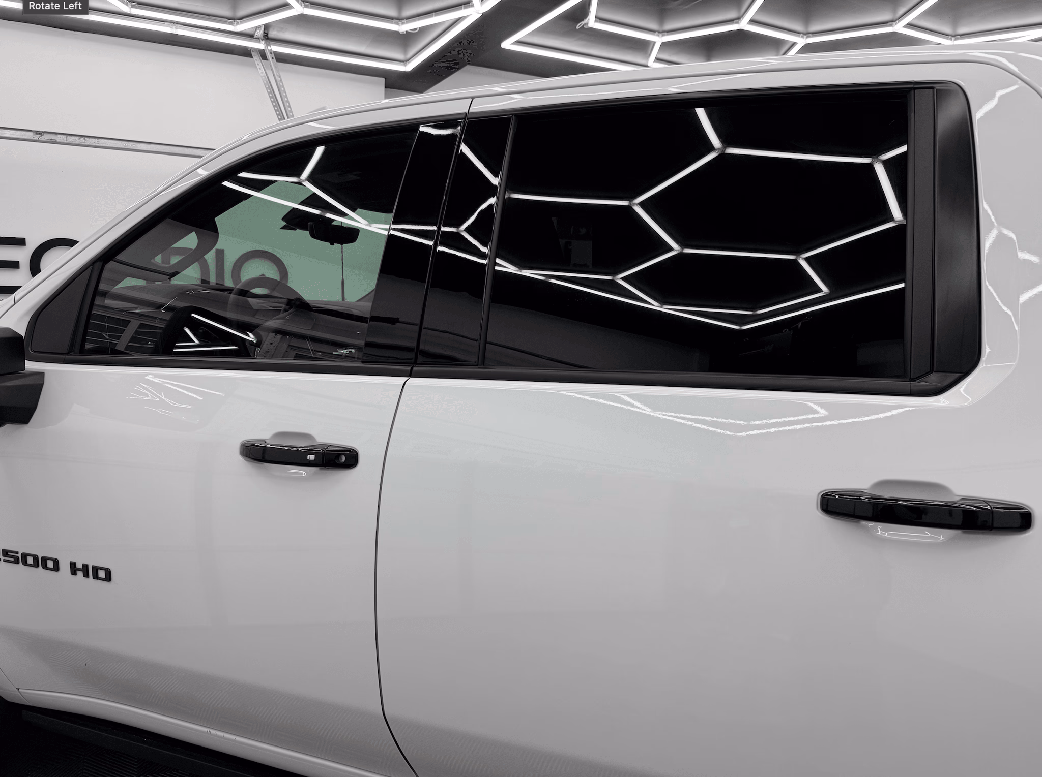 Silverado 2500 HD — fresh ceramic film, hex-lit shop bay.