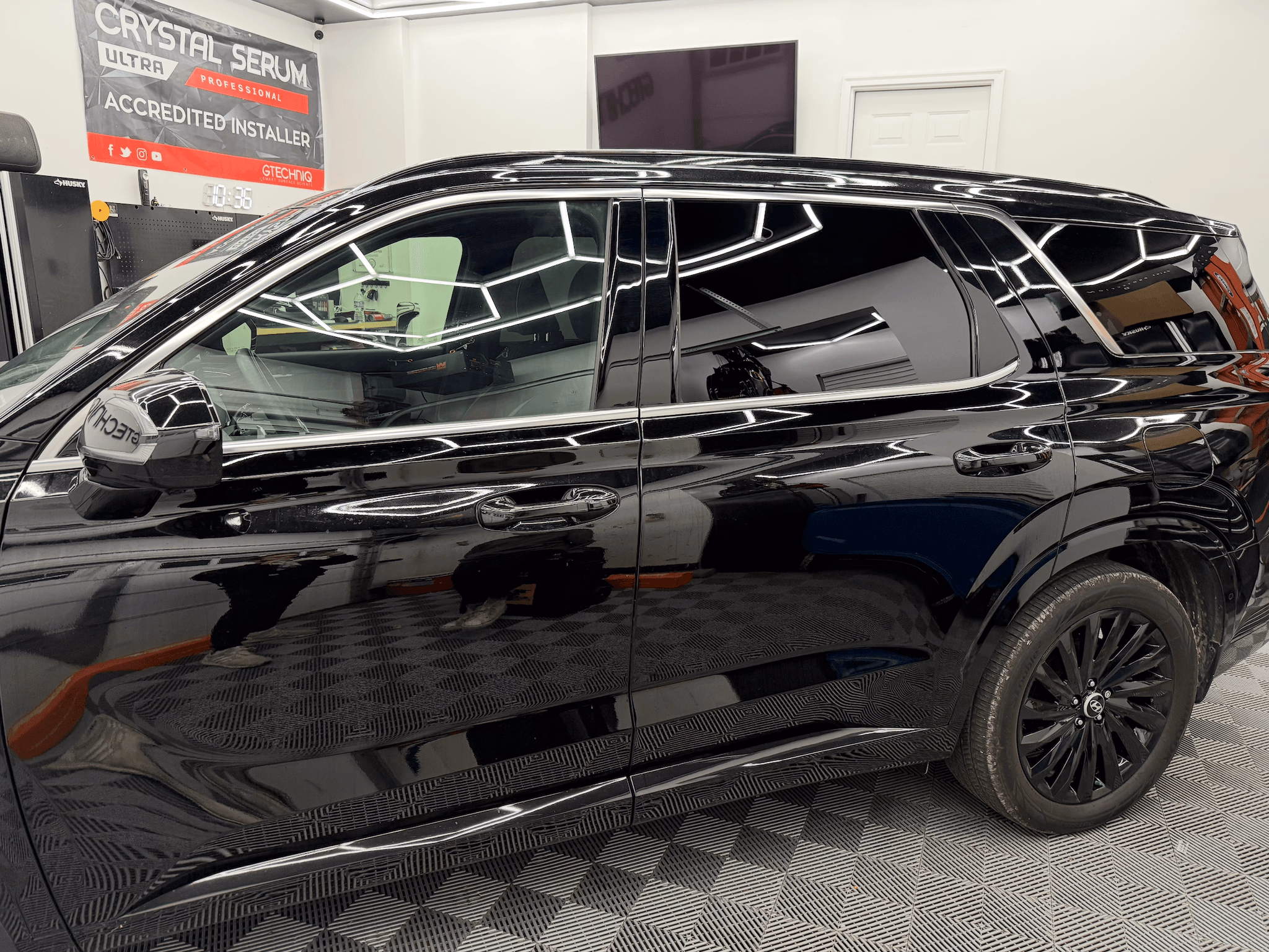 Side glass post-install — clean factory edges, no haze, no purple.