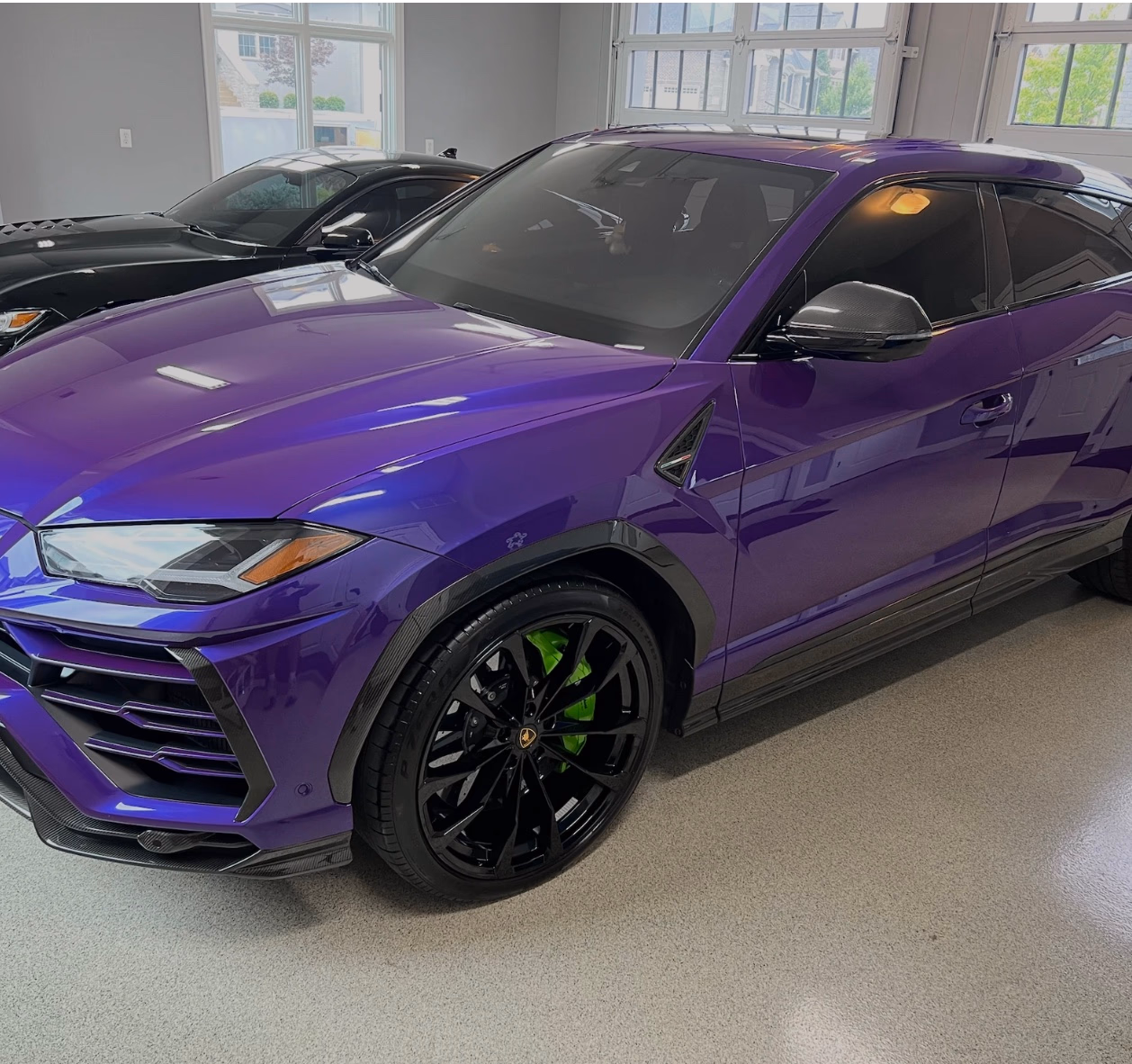 Lamborghini Urus — full color-change wrap in deep gloss purple.